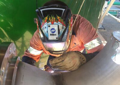 Tradie welding a pipe at Leichardt Power station